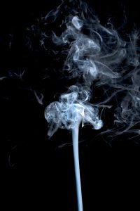 photo of smoke stream on black background how to remove smoke odor from your carpets